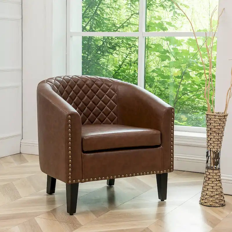 Gepolsterter Clubsessel aus Leder im Fassondesign mit Ziernägeln