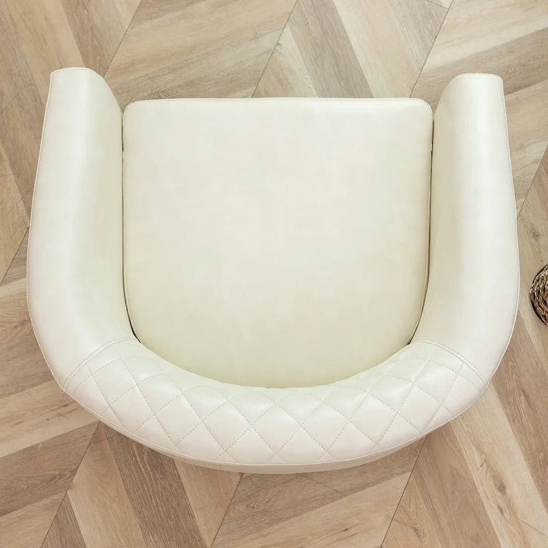 Gepolsterter Clubsessel aus Leder im Fassondesign mit Ziernägeln