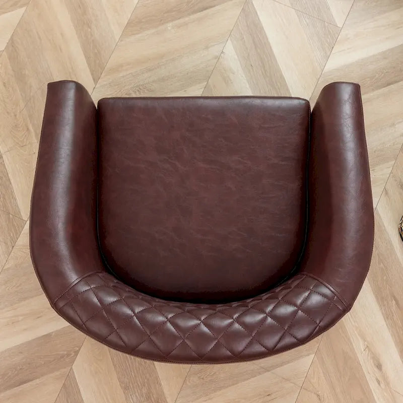 Gepolsterter Clubsessel aus Leder im Fassondesign mit Ziernägeln