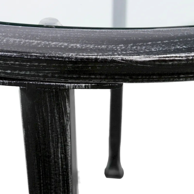 Runder Beistelltisch aus schwarzem Metall im Used-Look mit Glasplatte und Ablage
